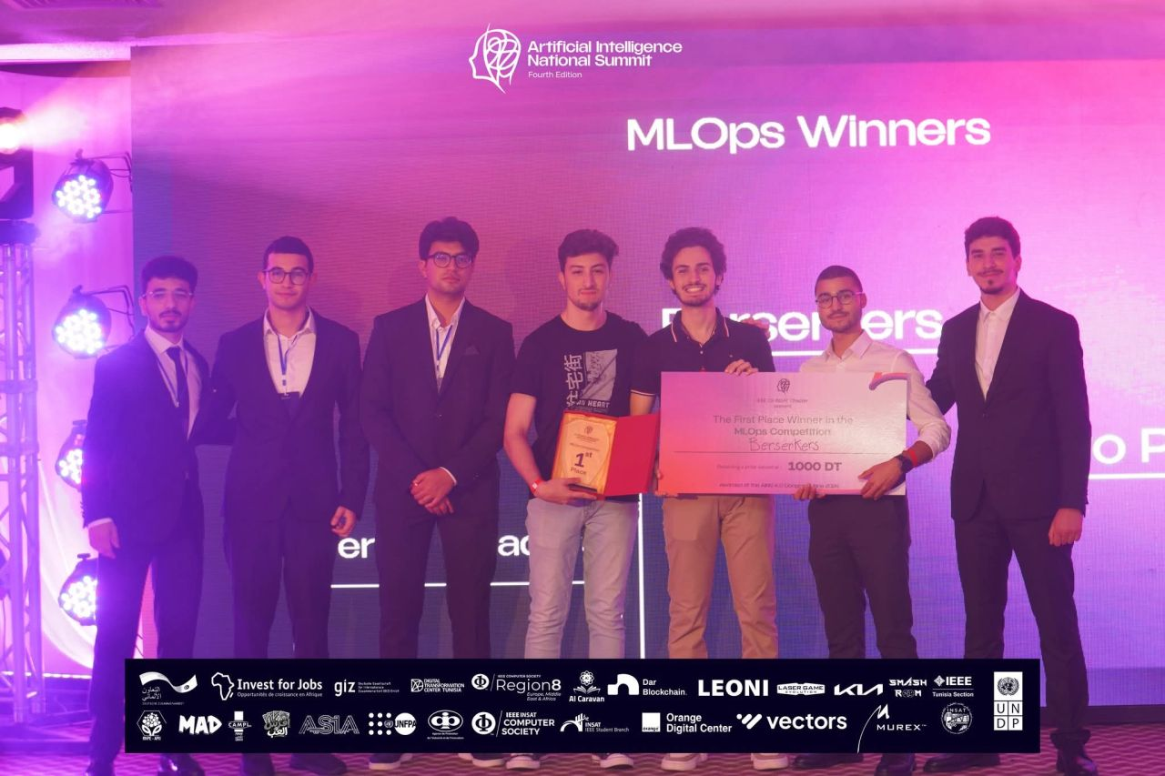 On stage as the MLOps winners at the AI National Summit, with the 1000 DT prize.